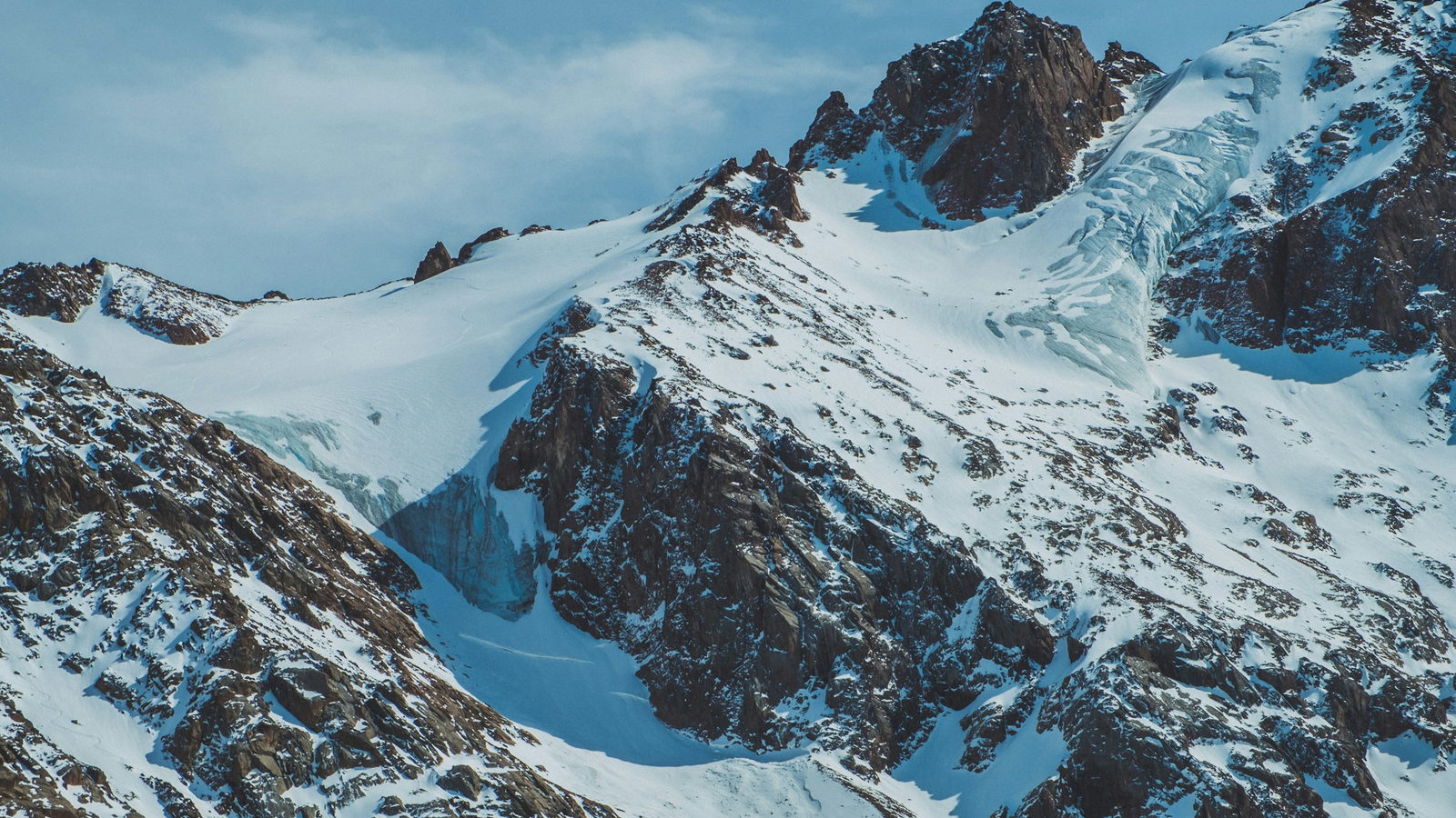 Snow-covered peaks and glaciers of the Trans-Ili Alatau above Shymbulak